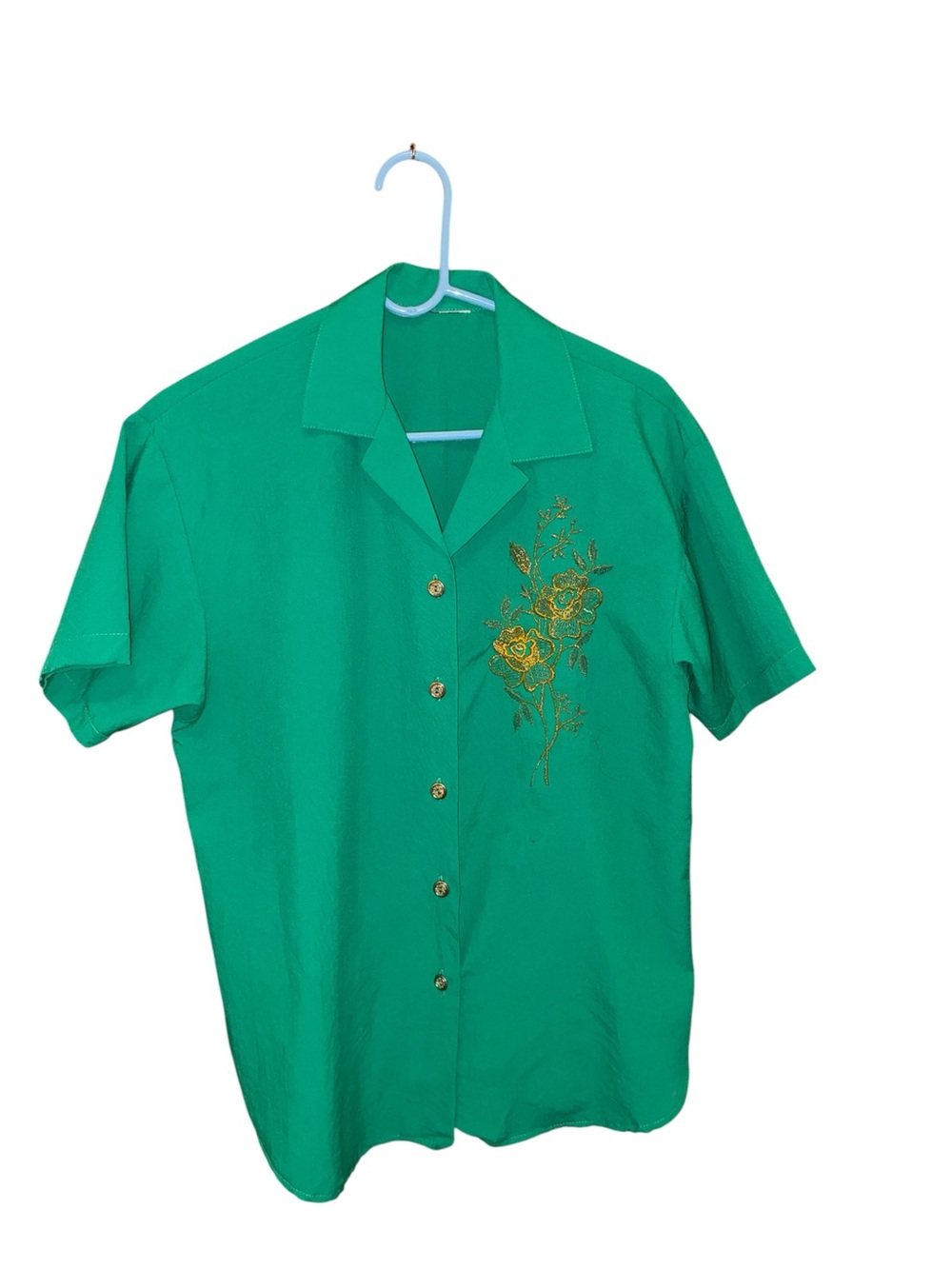 Vintage green blouse features intricate gold floral embroidery button details
